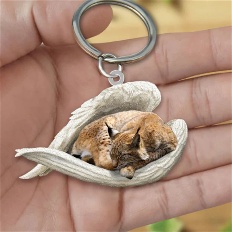 Pendentif Porte-clés Créatif Ange Endormi pour Animaux de Compagnie Un accessoire adorable et pratique. Gardez votre animal de compagnie près de vous avec ce charmant ange endormi.
