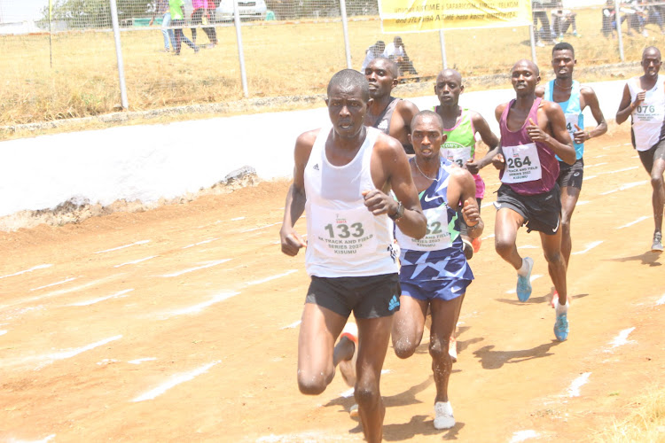 Athletes battle it out in the men's 5, 000 heats in at Moi Stadium