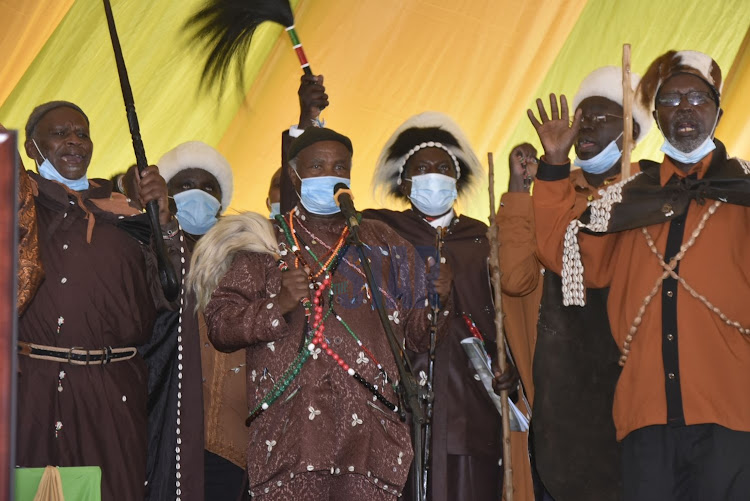 Elders of the Kikuyu Council of Elders and Kiama Kia Ma holding prayers during the requiem mass of the Christopher Kariuki and Peter Mbothu on October 16, 2020.