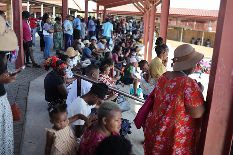 Community members gather to listen to an address by Education Minister Angie Motshekga during the first day of school, 11 January 2023, at Cosmo City Primary School in Diepsloot, Johannesburg, marking the start of the academic year in primary and high schools.