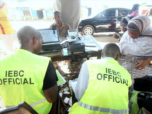 IEBC officials in Ngo'mbeni Kwale county on March 15 2016 gets details of voters during voter registration exercise. /FILE