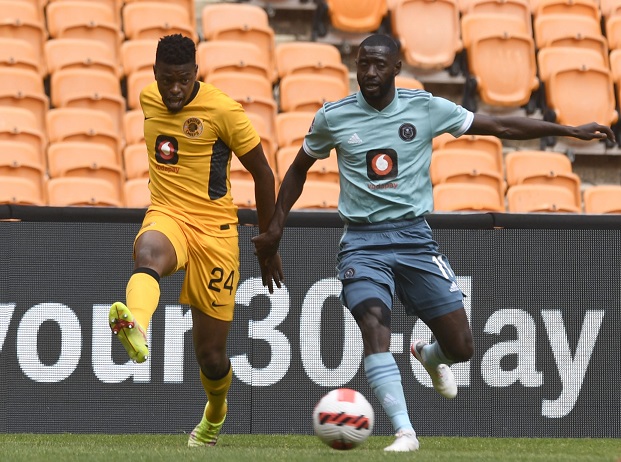 Phathutshedzo Nange of Kaizer Chiefs challenges Deon Hotto of Orlando Pirates in the DStv Premiership Soweto derby at FNB Stadium on November 6 2021.