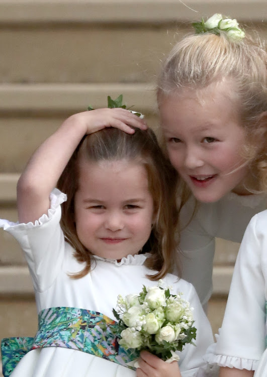 Savannah Phillips (right) and her second cousin Princess Charlotte at the wedding of Princess Eugenie in 2018.