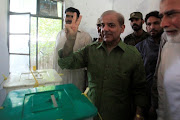 Shehbaz Sharif, brother of ousted prime minister Nawaz Sharif and leader of Pakistan Muslim League -Nawaz (PML-N), gestures after casting his ballot at a polling station during general election in Lahore, Pakistan July 25, 2018. 