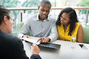 A file picture of a couple receiving financial advice.