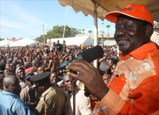 CROWD-PULLER: Raila Odinga addresses ODM supporters at a rally in Likoni, Mombasa. Many voters in Coast region perceive him as a man of the people. He tells them what they want to hear, he disguises himself as one of their own – walking, talking and behaving like one of the village elders somewhere in Kilifi county. Photo/File