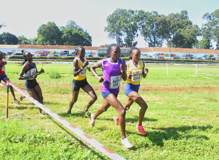 Gladys Kwamboka and Beatrice Chebet during the National Police Cross Country Championships at Ngong' Racecourse on January 19