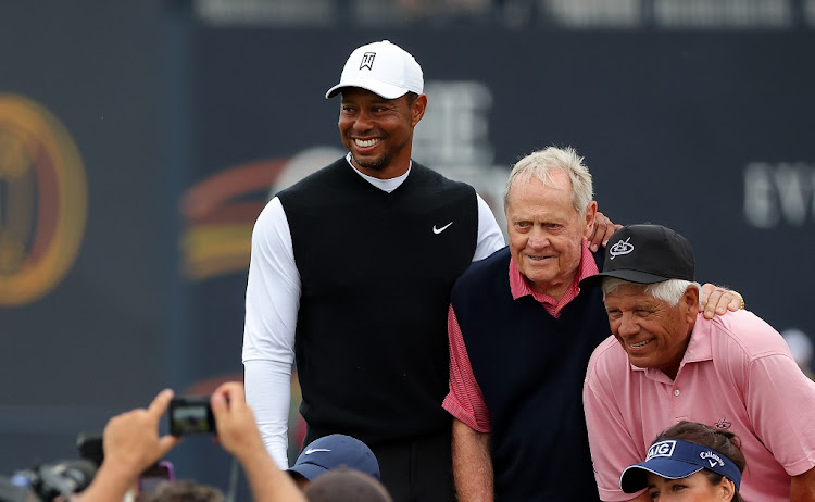 Tiger Woods, Jack Nicklaus and Lee Trevino of the US pose for a photo on the 18th bridge during the Celebration of Champions Challenge practice round prior to The 150th Open at St Andrews Old Course on July 11 2022.