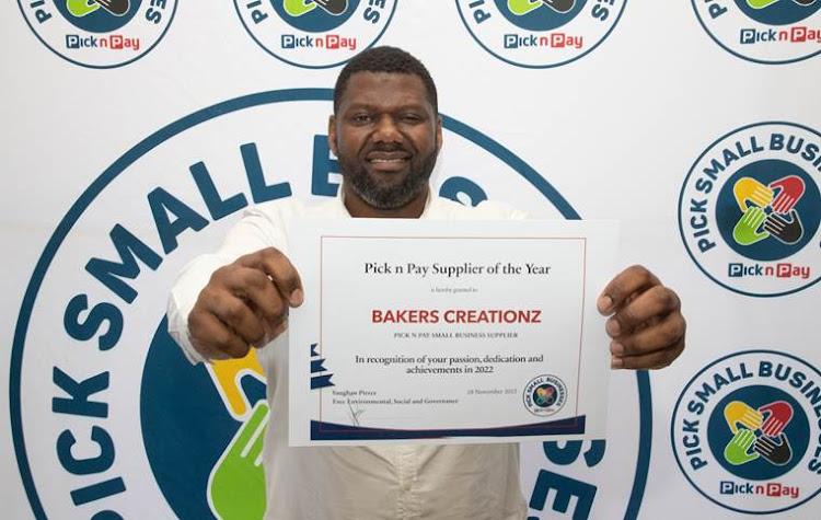 Njabulo Sithole, who started Bakers Creationz in his kitchen, with his award.