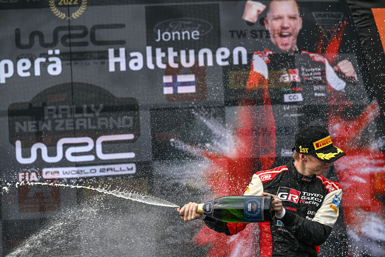 Kalle Rovanpera celebrates on the podium after winning the 2022 Rally New Zealand on October 2, 2022 in Auckland, New Zealand.