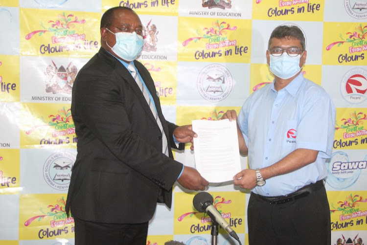 Pwani Oil Commercial Director Rajul Malde and Kenya Primary Schools Headteachers Association (KEPSHA) National Chairman Johnson Nzioka during the launch of ‘Sawa Colours in Life’, a Pwani Oil sponsored national essay writing competition targeting over 23,000 primary schools across the country/HANDOUT