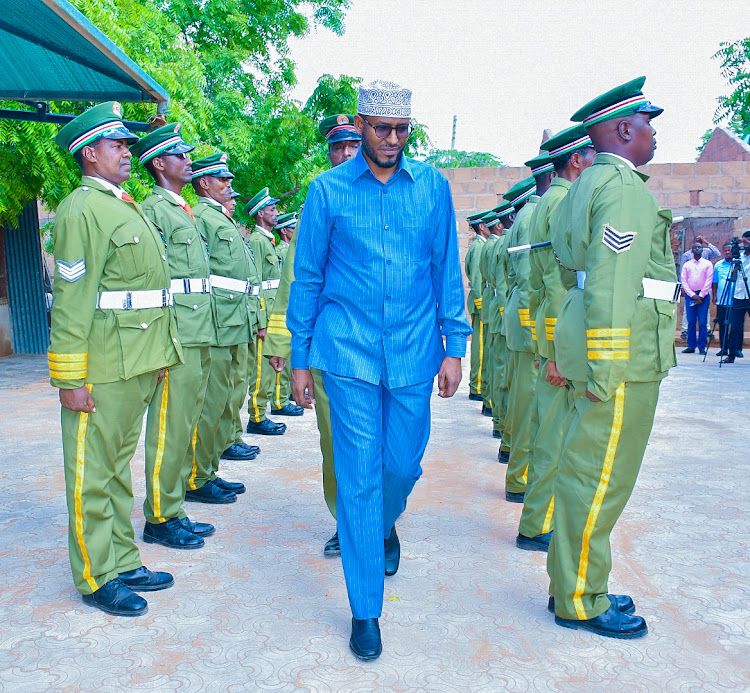 Wajir Governor Ahmed Abdullahi inspects the guard of honour mounted by county askaris at the Wajir county assembly.