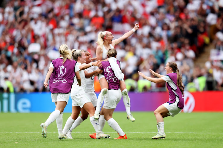 Chloe Kelly of England celebrates with her team after scoring her sides second goal in the UEFA Women's Euro 2022 final against Germany at Wembley Stadium on July 31, 2022 in London