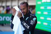 Pole position qualifier Lewis Hamilton of Great Britain and Mercedes GP celebrates in parc ferme during qualifying for the F1 Grand Prix of Spain at Circuit de Barcelona-Catalunya on May 08, 2021 in Barcelona, Spain.