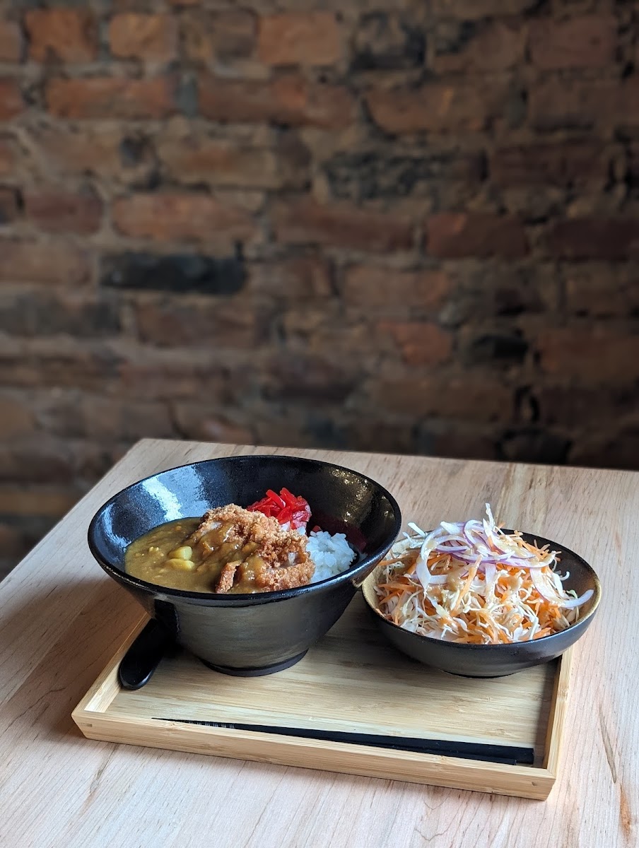 Japanese-style Curry with Chicken Cutlet on Rice. Comes with small salad and fukujimzuke (Japanese pickles). All made free of gluten.