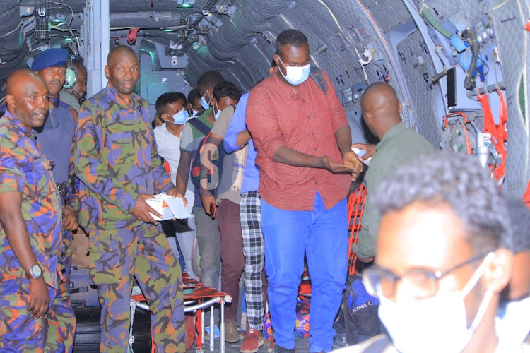 Kenyans evacuated from Sudan get off a plane at the Jomo Kenyatta International Airport on April 24,2023.