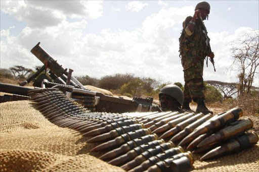 Kenya Defence Force (KDF) soldiers stand guard at the Kenya-Somalia border, February 20, 2012. /FILE