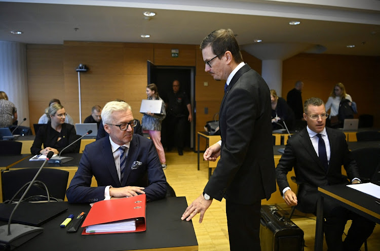 Helsingin Sanomat editor-in-chief Kaius Niemi and his lawyer Kai Kotiranta attend a hearing for the Helsingin Sanomat Finnish Intelligence Research Center court case in Helsinki, Finland, on August 25 2022. LEHTIKUVA/MARKKU ULANDER via REUTERS