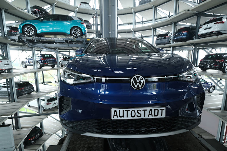 Volkswagen ID.4 and ID.3 electric cars stand on elevator platforms inside one of the twin towers used as storage at the Autostadt promotional facility next to the Volkswagen factory in Wolfsburg, Germany. The ID.3 and ID.4 are Volkswagen's first real effort to break into the growing electric car market and are aimed for mass appeal.