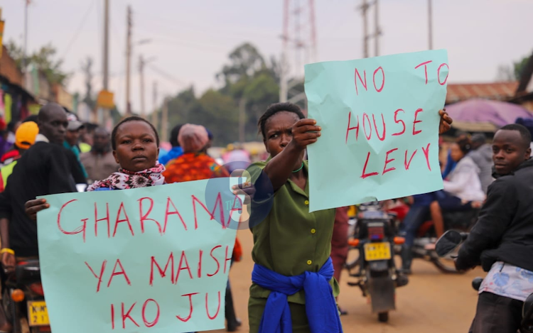 Demonstrators carrying placards in Luanda Town during the Saba Saba protests in July 7, 2023.