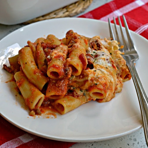 This Baked Ziti pasta casserole is loaded with Italian Sausage, marinara, ricotta, mozzarella and Parmesan cheese and baked to a hot luscious gooey delight.  Serve with a simple garden salad and crusty French bread.