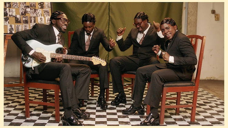 Sauti Sol in black suits with wide legged pants