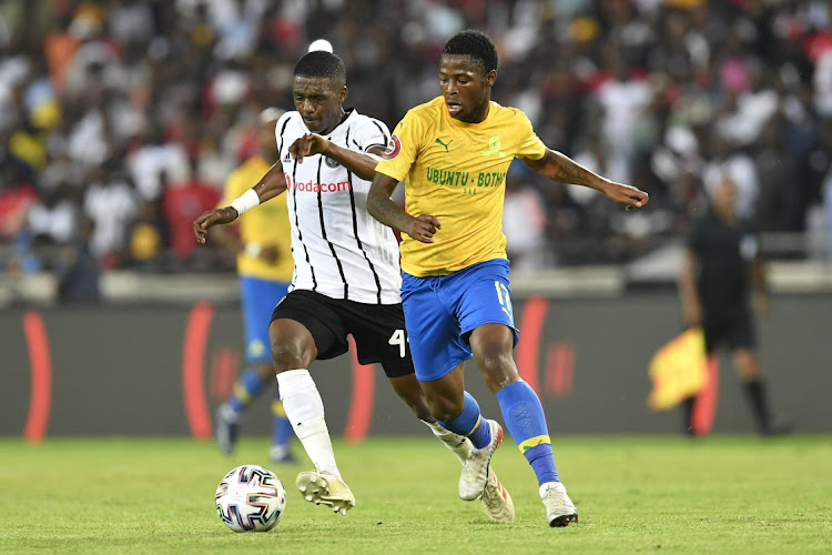 LET THE GAMES BEGIN: Abel Mabaso of Orlando Pirates and Phakamani Mahlambi of Mamelodi Sundowns compete for the ball during an Absa Premiership match in January. The teams are set to clash again on Tuesday.