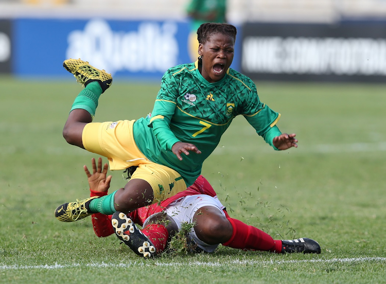 Lídia Lubano of Angola tackles Noxolo Cesane of South Africa during the Cosafa Women's Championship match at Madibaz Stadium in Port Elizabeth on October 1 2021.