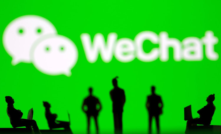 Small toy figures are seen in front of WeChat logo in this illustration photo. Picture: REUTERS/DADO RUVIC