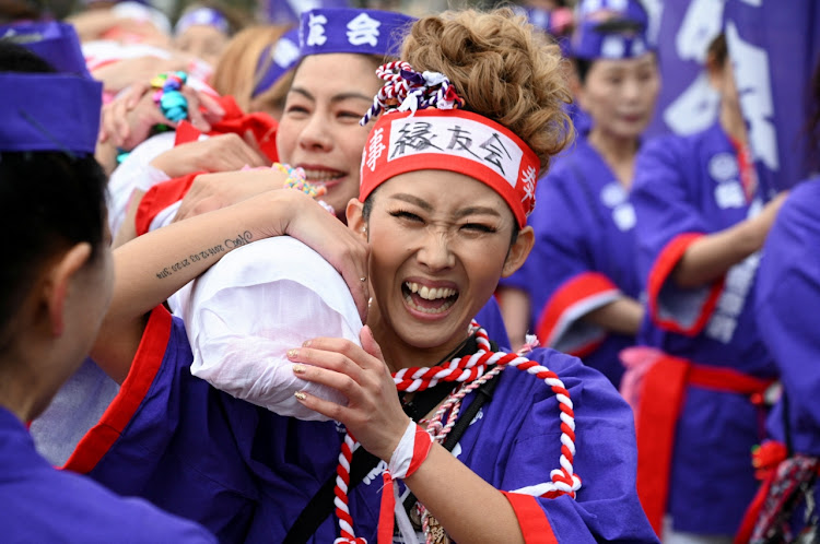 Women take part in a ritual event of the Hadaka Matsuri, or the Naked Festival, for the first time. The festival has been taking place at the Konomiya Shrine in central Japan for 1,250 years.