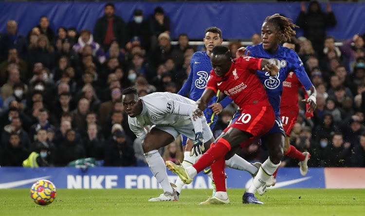 Liverpool's Sadio Mane scores his side's first goal against rivals Chelsea in a Premier League match played at Stamford Bridge on Sunday January 1, 2022.