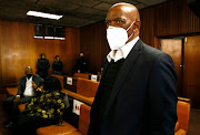 Suspended ANC secretary-general Ace Magashule and 15 other co-accused appeared in the high court in Bloemfontein on August 11 2021 in connection with a R255m asbestos tender. It emerged on Wednesday that his former personal assistant will now be an accused in the case after not cooperating with the state.