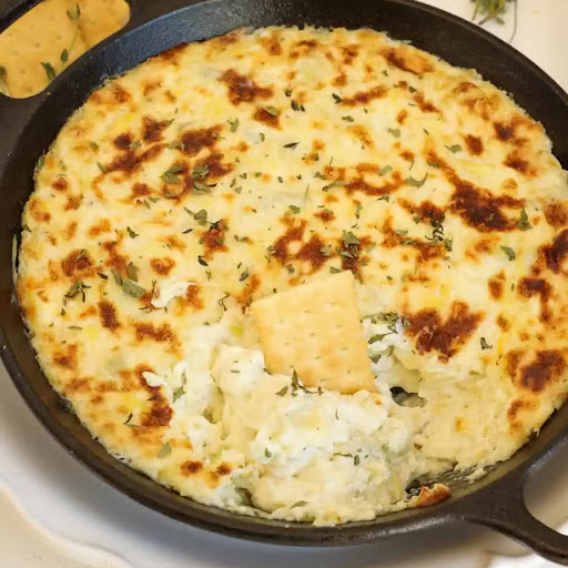 Learn how to make this quick and tasty artichoke dip in just a few simple steps. It is always a huge win for gameday and movie nights.
