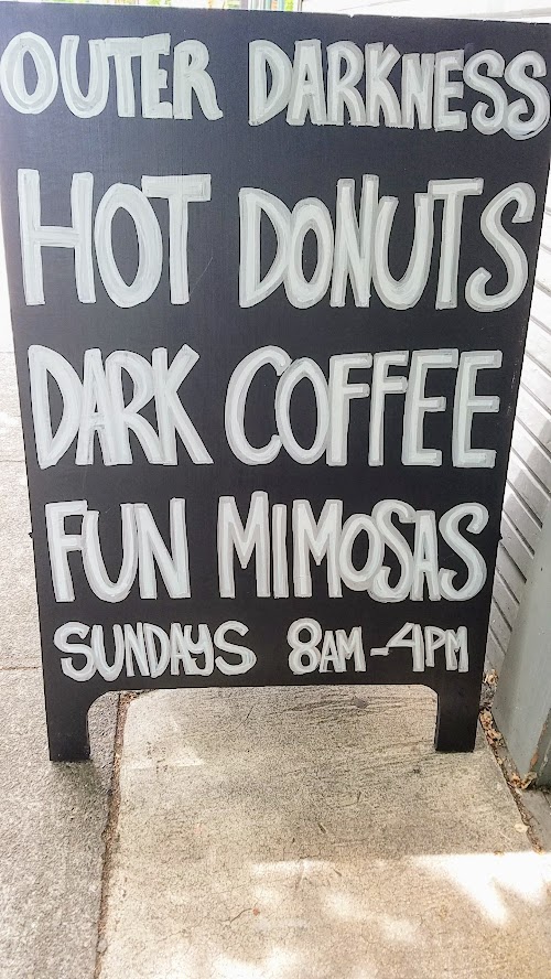 My first look at Outer Darkness Donuts, which on offer here only on Sundays are dark roast drip coffees, fun mimosas, loose leaf tea, and only one food dish you can order: a flight of mini-donuts.