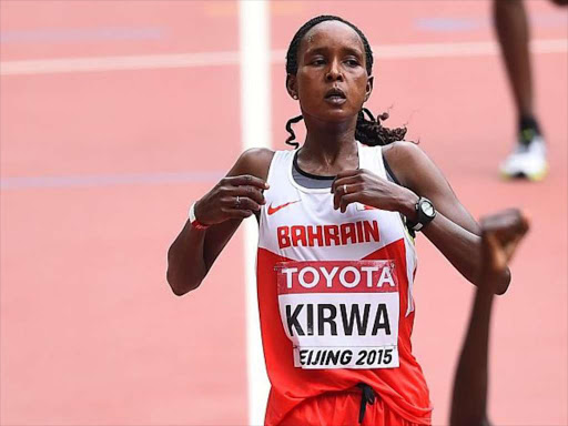 Eunice Jepkirui Kirwa of Bahrain reacts after crossing the finish line to win bronze in the Women's Marathon final during the '15th IAAF World Athletics Championships Beijing 2015' at Beijing National Stadium (Bird's Nest) on August 30, 2015.