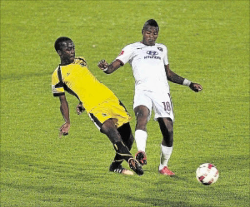 RIGHT PLACE, RIGHT TIME: Harry Nyirenda of Leopards, left, fights for the ball with Moroka Swallows' two-goal hero Vuyisile Wana on Wednesday Photo: Veli Nhlapo