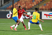 Percy Tau of Al Ahly attempts to control the ball in the Caf Champions League match against Mamelodi Sundowns at Cairo International Stadium on February 26 2022.