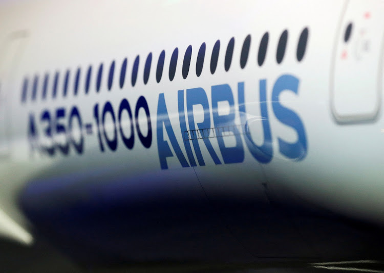 The Airbus logo on a scale model of an Airbus A350-1000. Picture: REUTERS/REGIS DUVIGNAU