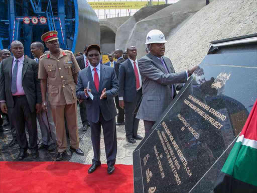 Transport CS James Macharia (C) and President Uhuru Kenyatta during the launch of construction work for the Nairobi-Naivasha SGR Phase 2A project at the Embulbul site on October 19 /PSCU