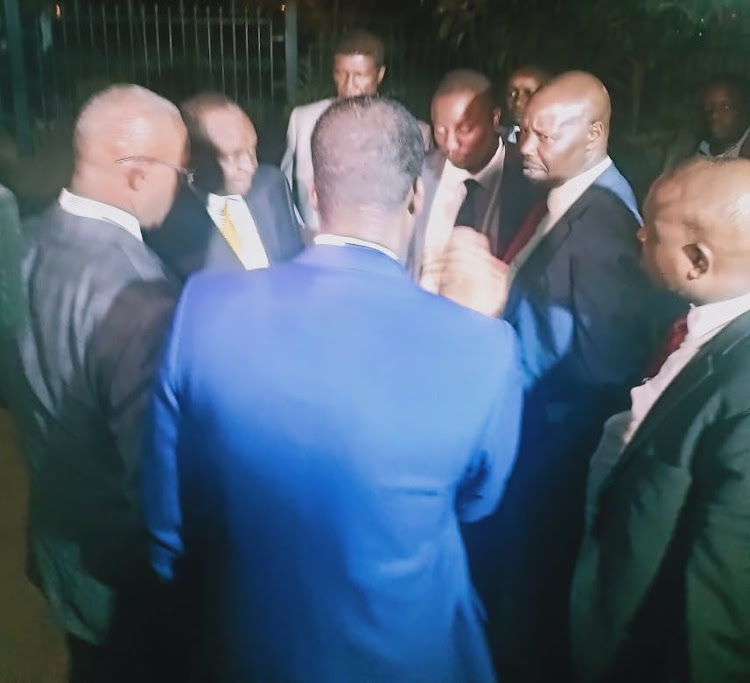 Treasury CS Henry Rotich and PS Kamau Thugge with their lawyers after being released on Tuesday evening.