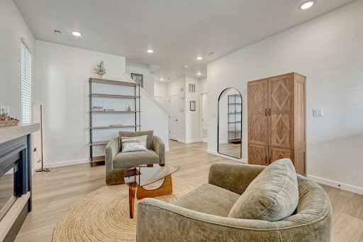 Modern living room with armchairs and shelves - Property purchase in Littleton, 4 bedrooms