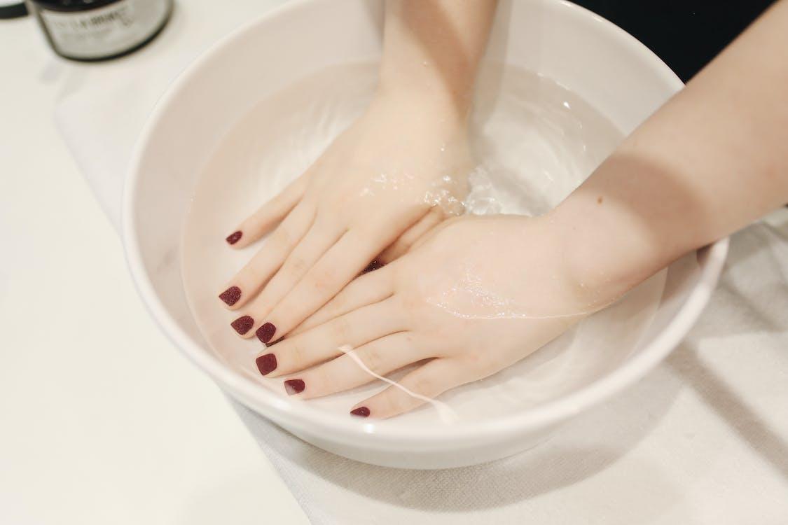 Free Photo of Person`s Hand Soak in Water Stock Photo