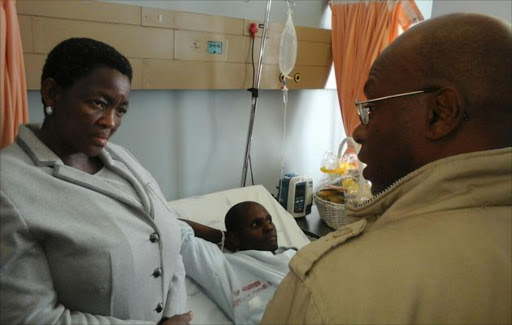 Social Development Minister Bathabile Dlamini visting pay point victim Samuel Malemela at Dr George Mukhari Hospital on Wednesday. Picture Credit: Sipho Masombuka