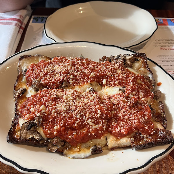 Detroit Style Pizza with red sauce, cheese, mushrooms & sausage