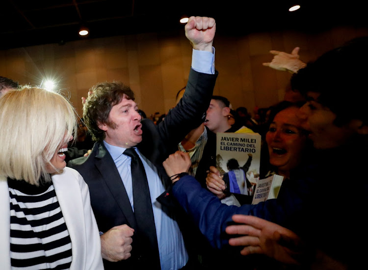 Argentine congressman Javier Milei gestures to supporters before the presentation of his book "El Camino del Libertario", at the Buenos Aires International Book Fair in Buenos Aires, Argentina May 14 2022. Picture: REUTERS/AGUSTIN MARCARIAN