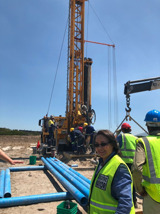 Cape Town mayor Patricia de Lille with a drill tapping the Cape Flats aquifer in Mitchells Plain.