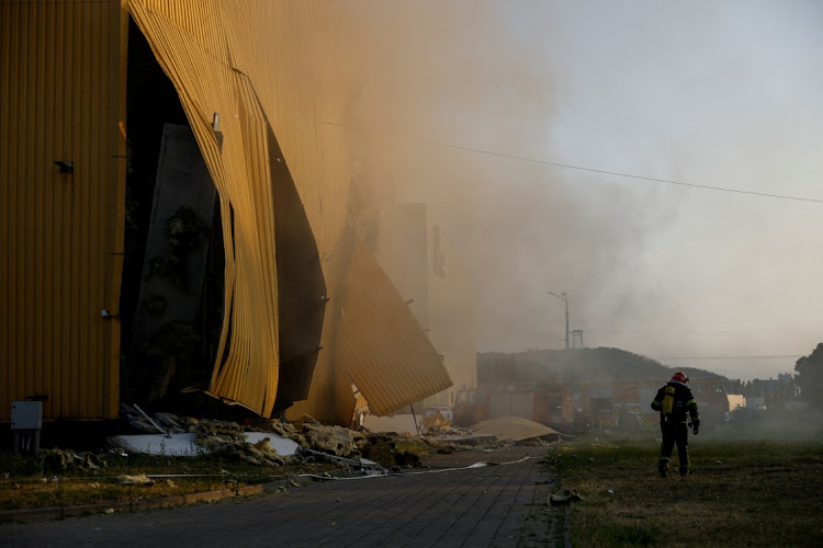 A firefighter works at a site of a factory damaged during Russian drone strikes in Kyiv, Ukraine, May 28 2023. Picture: VALENTYN OGIRENKO/REUTERS