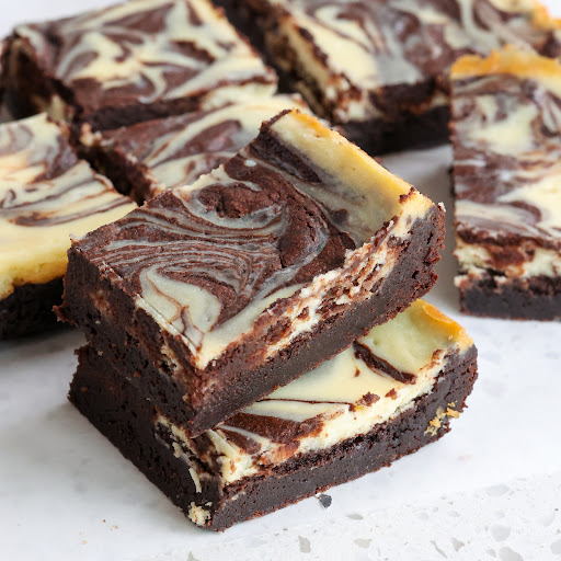 Always delicious Cream Cheese Brownies made from scratch with a rich fudgy chocolate base and a creamy cheesecake swirl