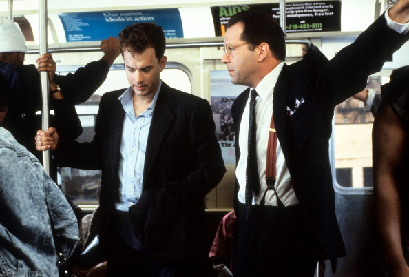 Tom Hanks and Bruce Willis riding the bus in a scene from the film 'The Bonfire of the Vanities', 1990