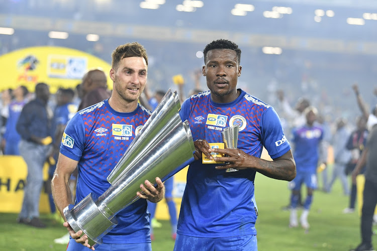 SuperSport United strikers Bradley Grobler and Thamsanqa Gabuza with the MTN8 trophy after their team's 1-0 win in the final against Highlands Park at Orlando Stadium on October 5.